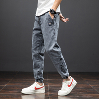 Wiosna lato czarne niebieskie dżinsy Cargo mężczyźni Streetwear Denim spodnie do biegania mężczyźni Baggy Harem Jean spodnie Plus rozmiar 6XL 7XL 8XL 5